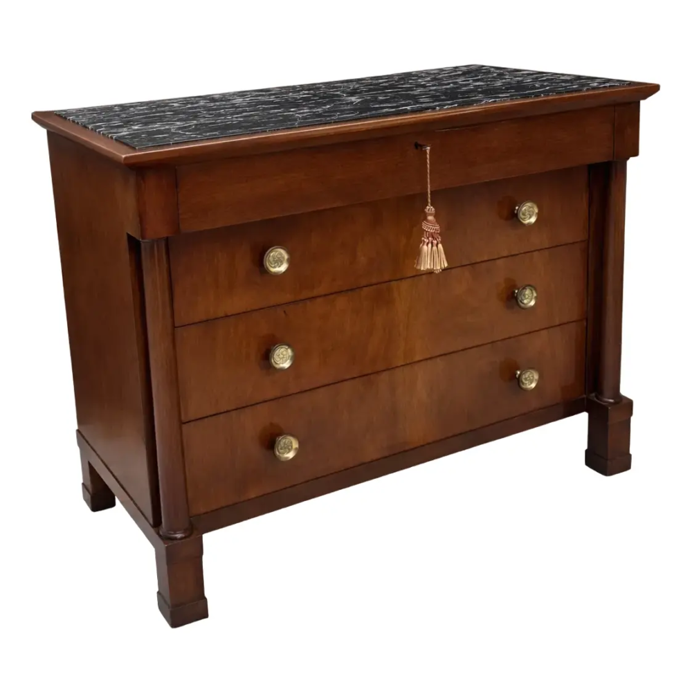 Early 20th Century John Stuart French Empire-Style Walnut Commode With a Black Marble Top.