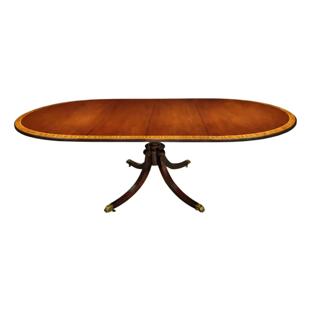 English Regency Revival Flame Mahogany Oval Extension Dining Table With Satinwood Crossbanding and Brass Paw Feet, Circa 1935