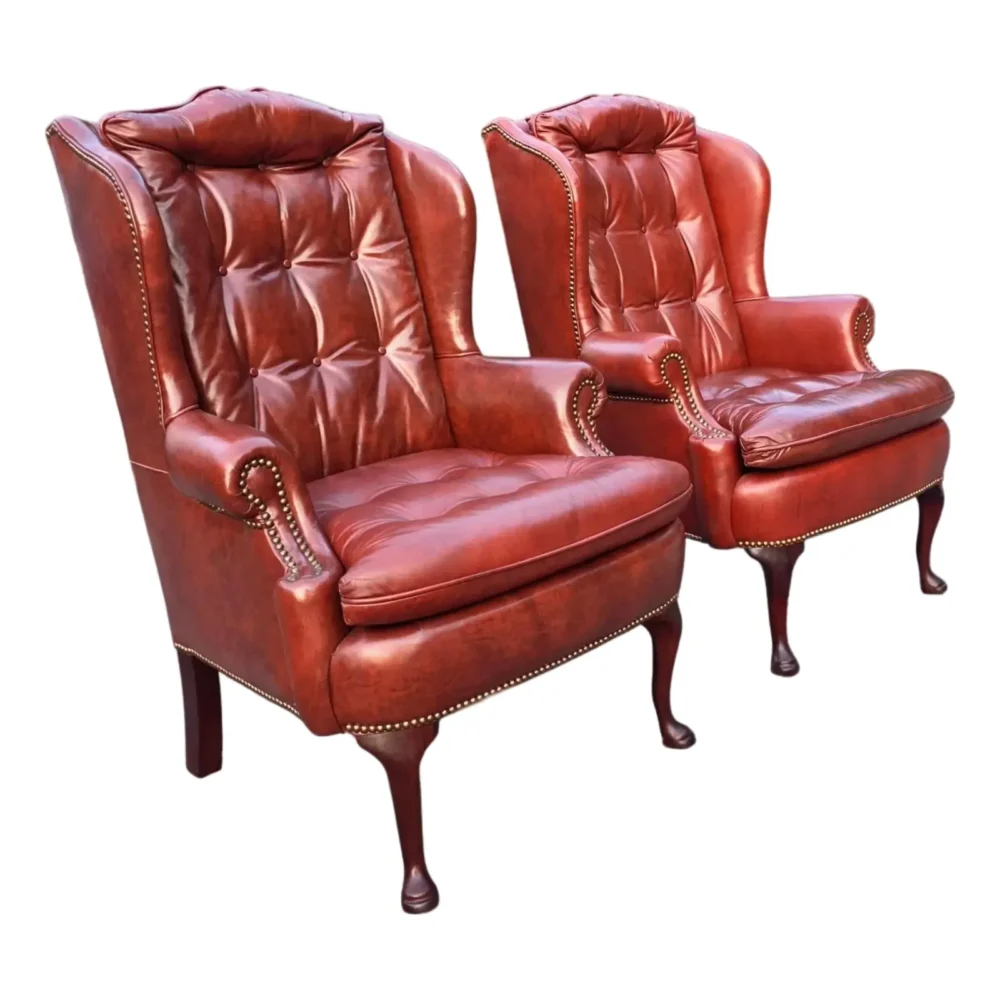 Pair of Classic Leather Furniture Tufted Oxblood Leather Wingback Library Lounge Chairs With Brass Nailhead Trim, Circa 1980s